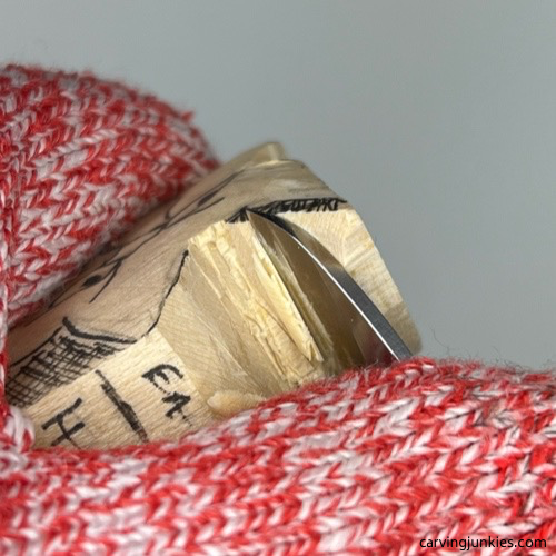 Carving head on cat whittling Carving the ears on whittled cat