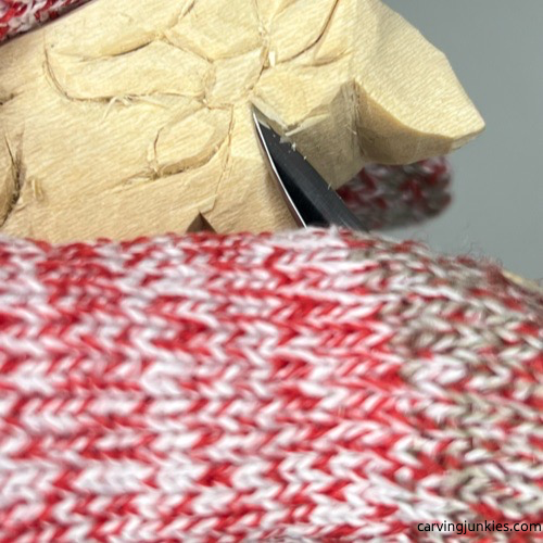 Adding depth to face of cat whittling Carving forehead on whittled cat