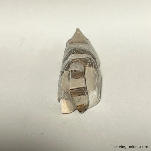 Back view of painted cat whittling Back view of painted whittled cat