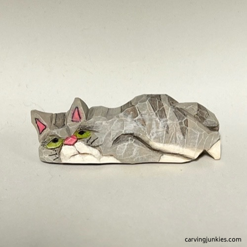 Front view of painted cat whittling Front of painted whittled cat