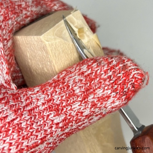 Shaving off wood on cat whittling Carving roughout of whittled cat