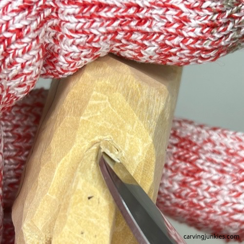 Carving back tail on cat whittling Angling the tail on whittled cat