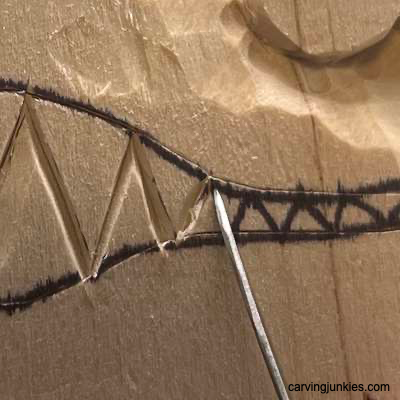 Separating teeth on wooden fish