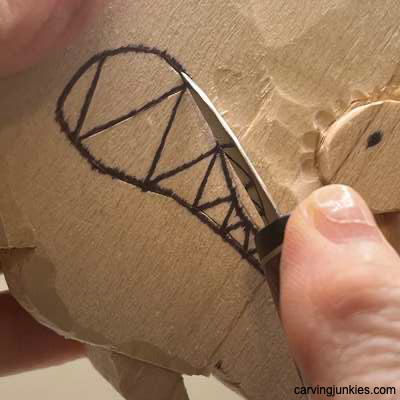 Starting the mouth on fish wood carving