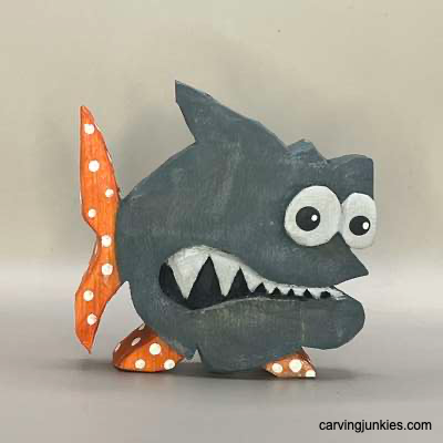 Painted wood carved fish from the front