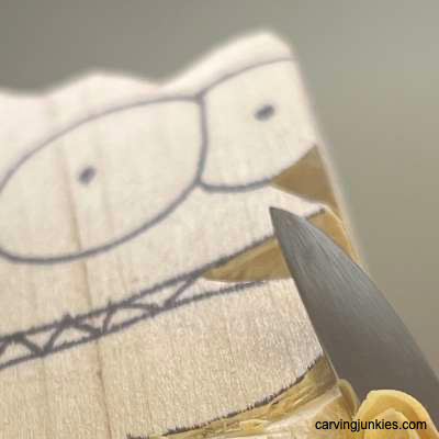Removing wood to create whittled fish