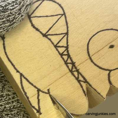 Making stop cut on whittled fish