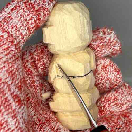 Carving the back of the wooden Buddha