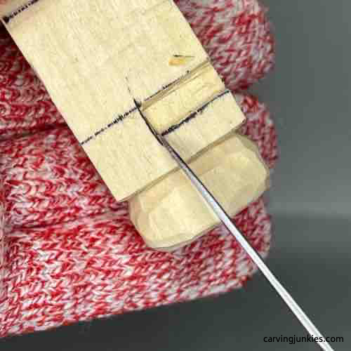 Separating toe box on wood carved buddha