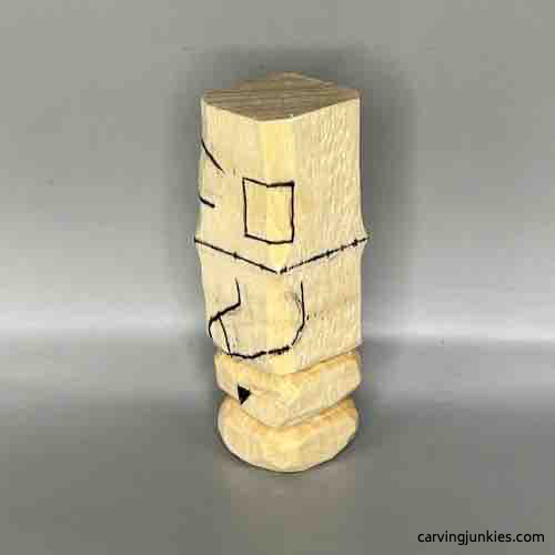 Left view of sketched details on wood carved Buddha