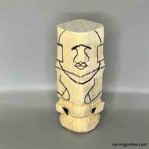 Head details are sketched o wooden Buddha