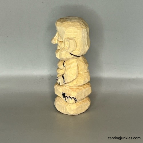 Left details on wood carved Buddha