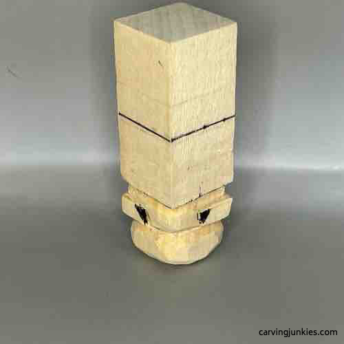 Wood marked for removal on Buddha