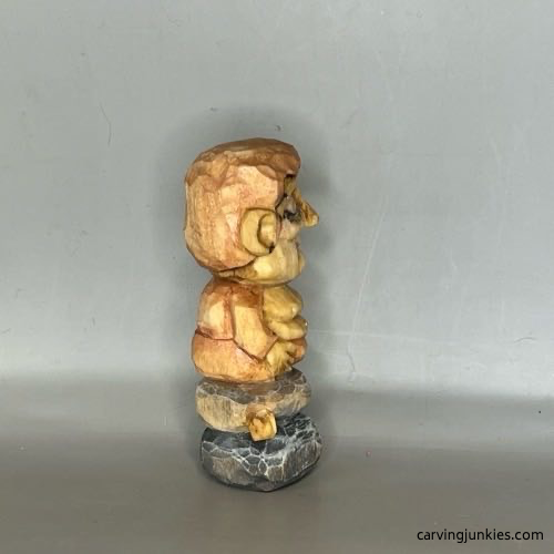 Right view of painted wood carved Buddha