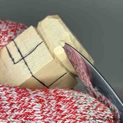 Rounding rock on wood carved Buddha