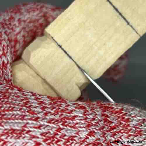 Starting to separate the back on wood carved Buddha