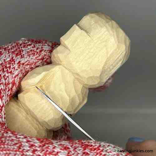 Carving the waist on wood carved Buddha