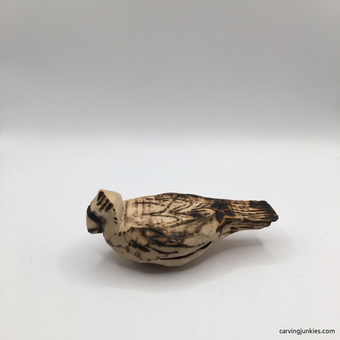 Left view of wood burned cardinal