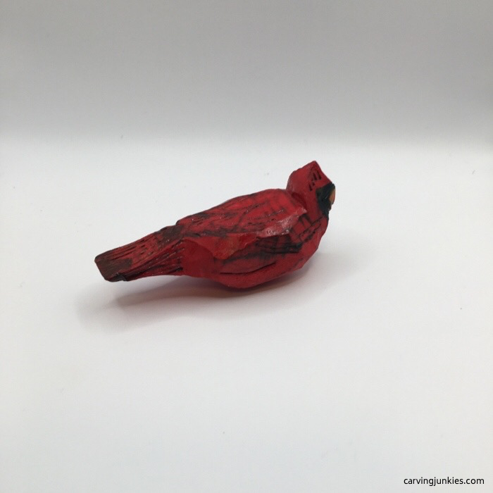 Right side of painted wood cardinal