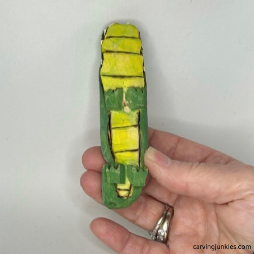 Underbelly of painted wood carved alligator