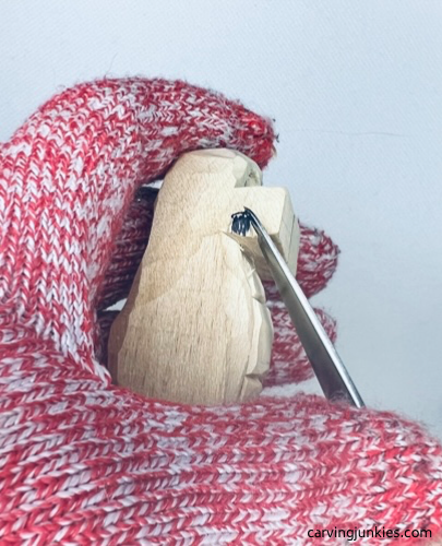 Carving feet on wood carved alligator