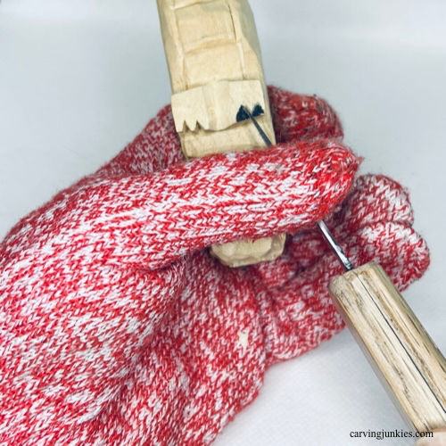 Carving claw on wood carved alligator