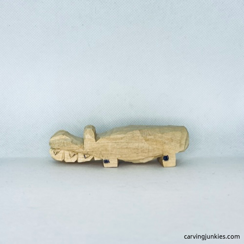 Wood on left is marked for removal on wood carved alligator