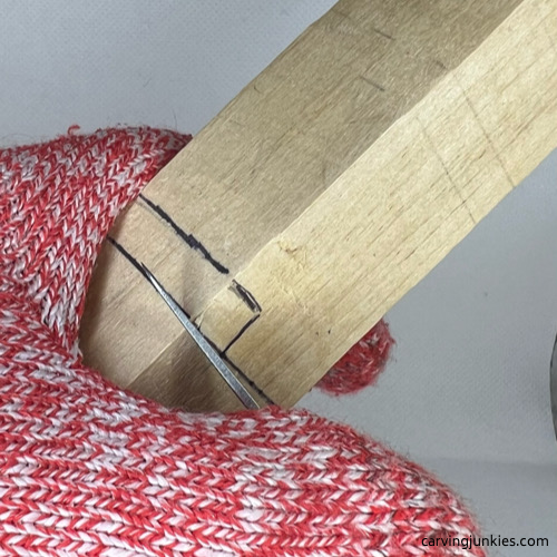 Use our step-by-step tutorials Making a stop cut on wood carved alligator