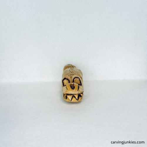 Wood burned front of wood carved alligator