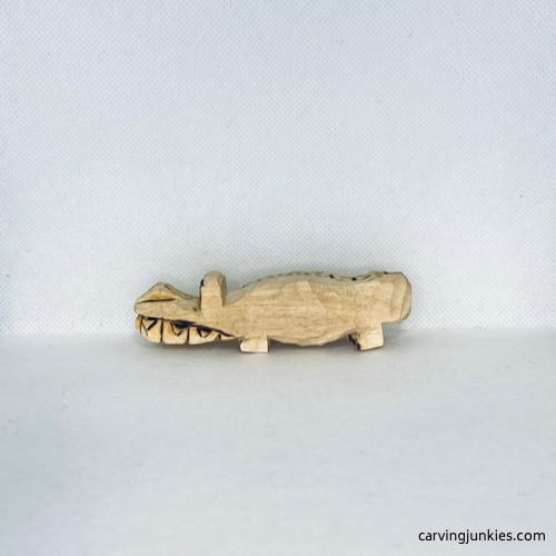 Left view of wood burning on wood carved alligator
