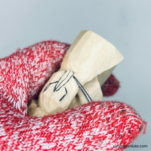 Separating arms on wood carved angel