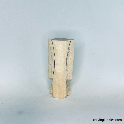 Back wings are sketched on wood carved angel