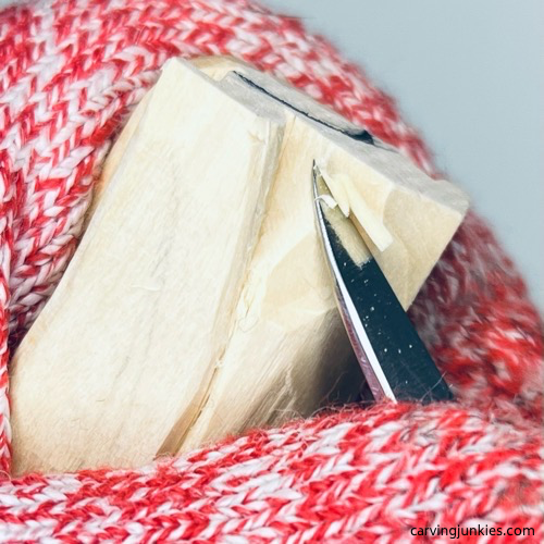 Shaping back of the head on wood carved angel