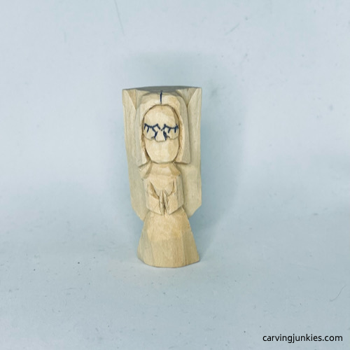 Cheeks are carved on wood carved angel