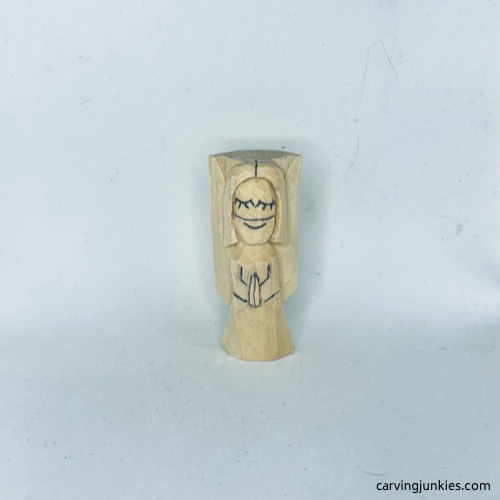 Details drawn on wood carved angel