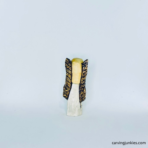 Back view of painted wood carved angel