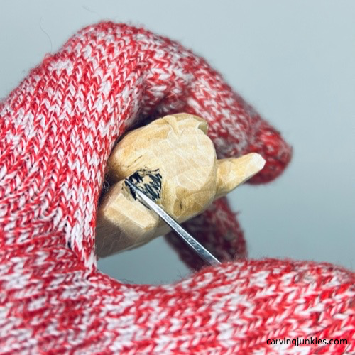 Making a wide V-cut on wood carved angel