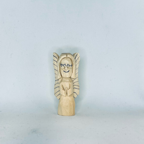 Lines on wings of wood carved angel