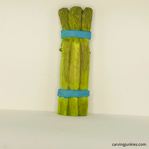 Back view of painted wood carved asparagus