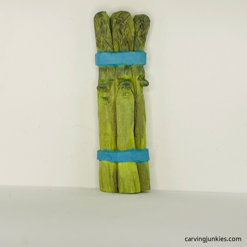 Front view of painted wood carved asparagus