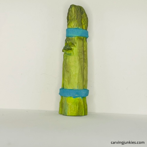 Left view of painted wood carved asparagus