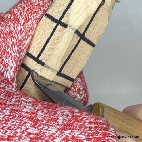 Separating rubber band on wood carved asparagus