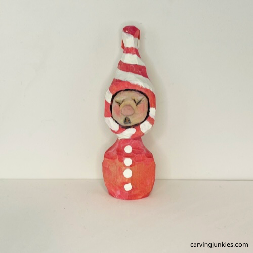 Front of painted wood carved Christmas caroler