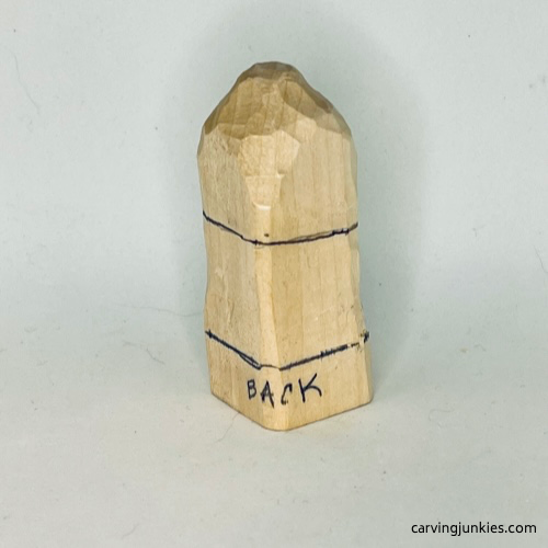 Back view of neckline on wood carved caveman Neckline on back of wood carved caveman