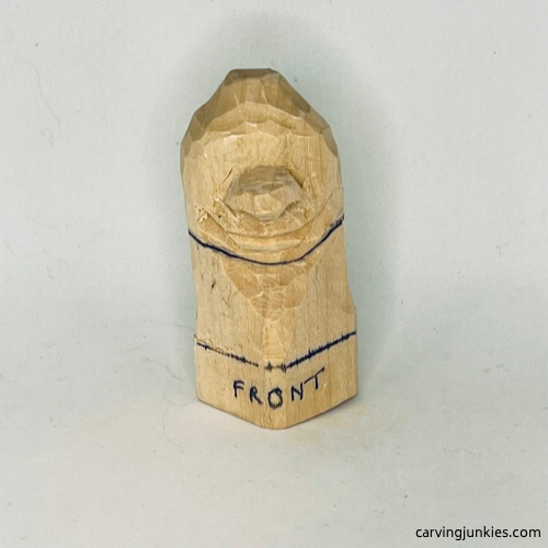 Front neckline on wood carved caveman Neckline is added to wood carved caveman