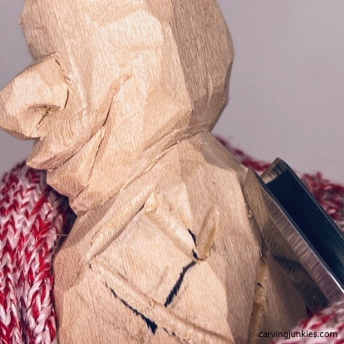 Carving arm on wood carved caveman Separating arm on wood carved caveman