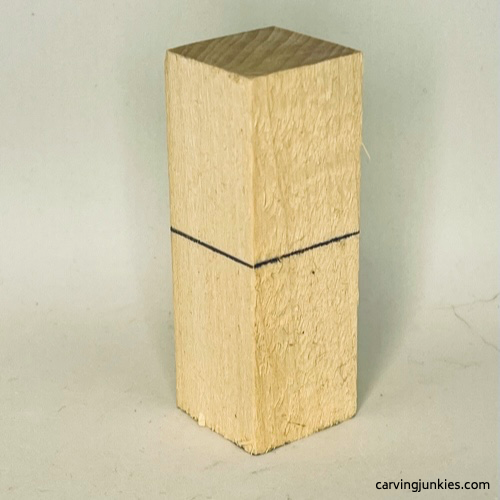 Wood block for wood carved ice cream cone is marked Guideline all around for wood carved ice cream cone