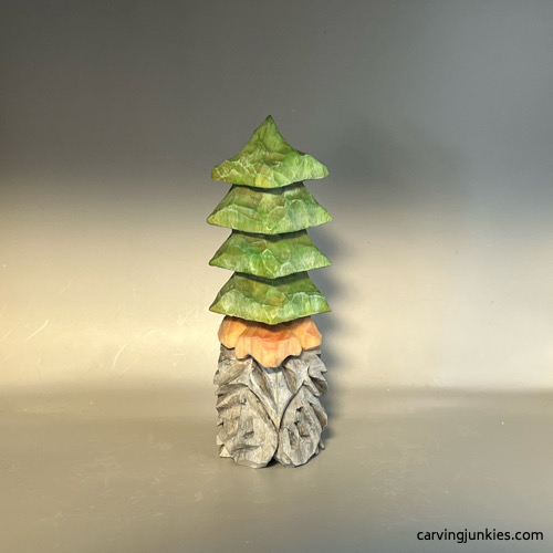 Painted front of wood carved Christmas gnome