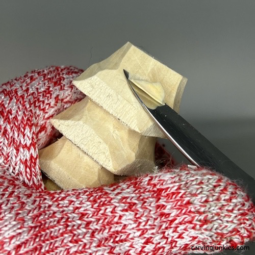 Carving top of wood carved Christmas tree gnome