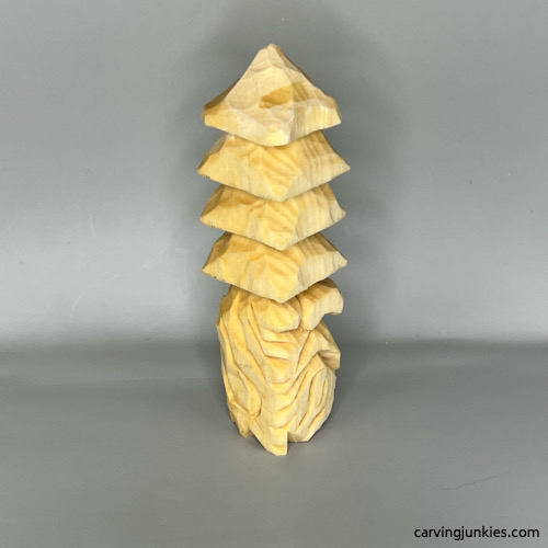 Right view of unpainted wood carved Christmas tree gnome